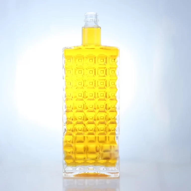 015 - Hot Sale 1 liter Embossed Logo Glass Bottle