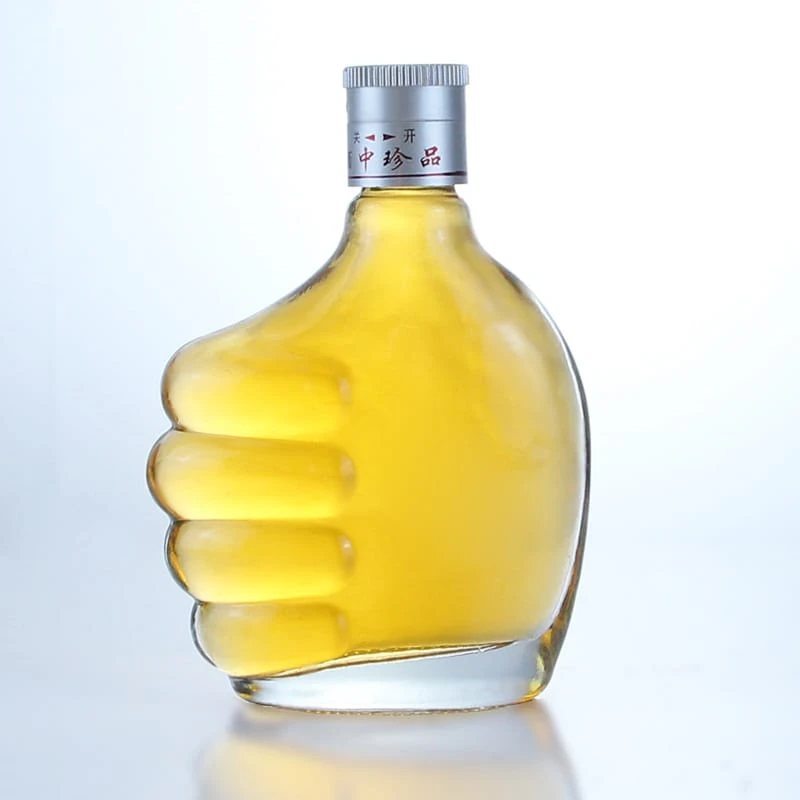 285 - Unique Hand Shape Flint Glass Bottle For Wholesale